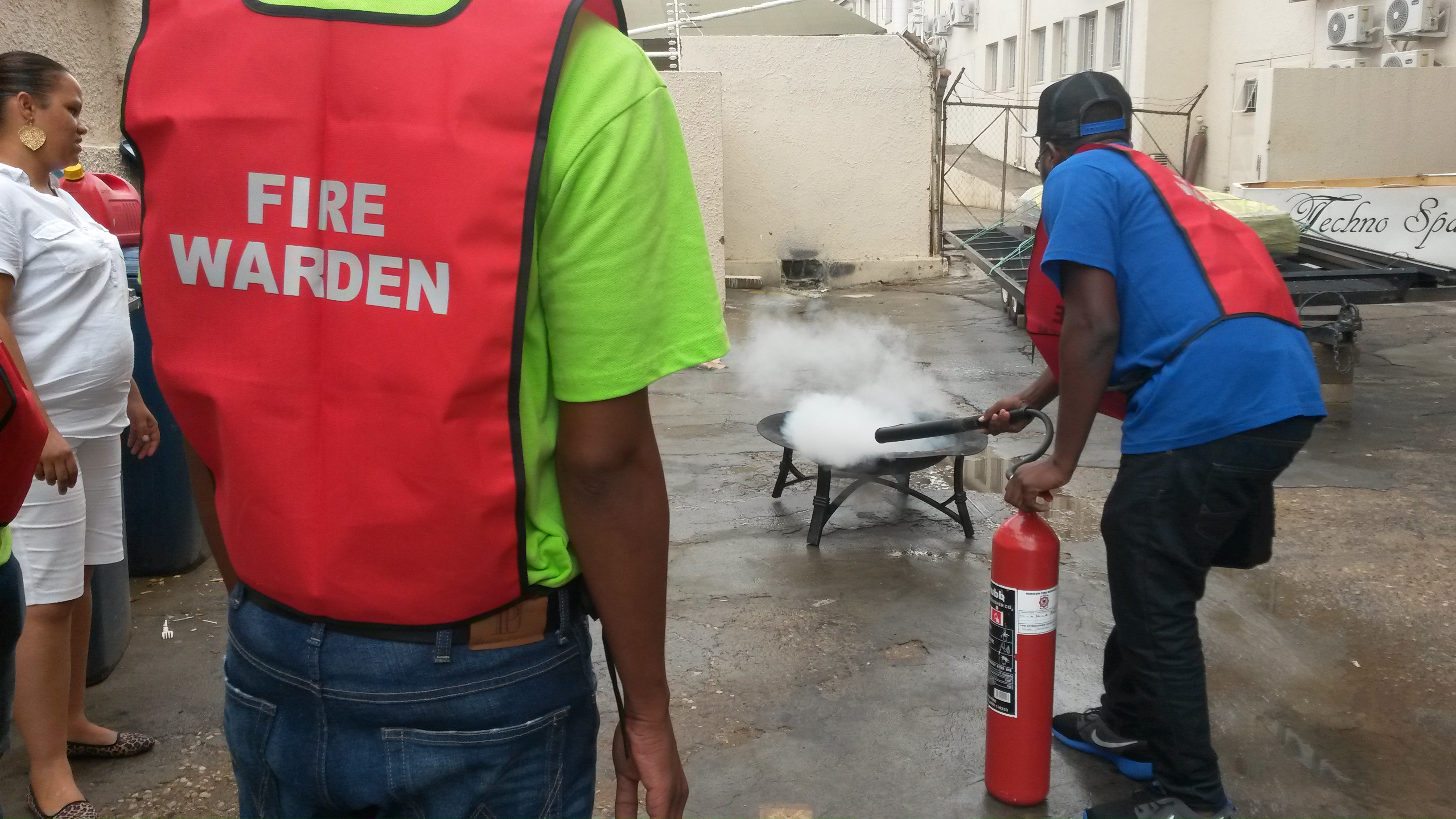 Participants completing practical industrial firefighting training